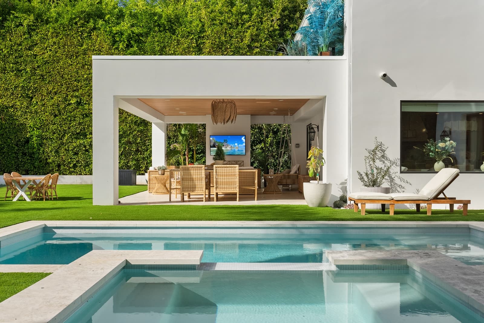 Backyard pool with a covered patio and outdoor living room