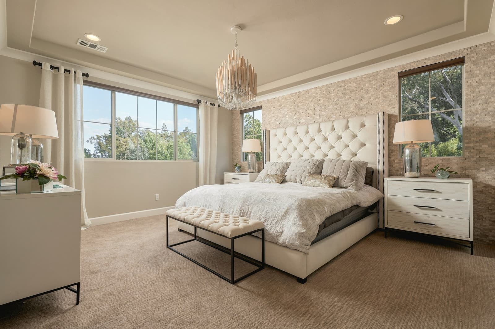 Bedroom with a tufted headboard and a view to the hills