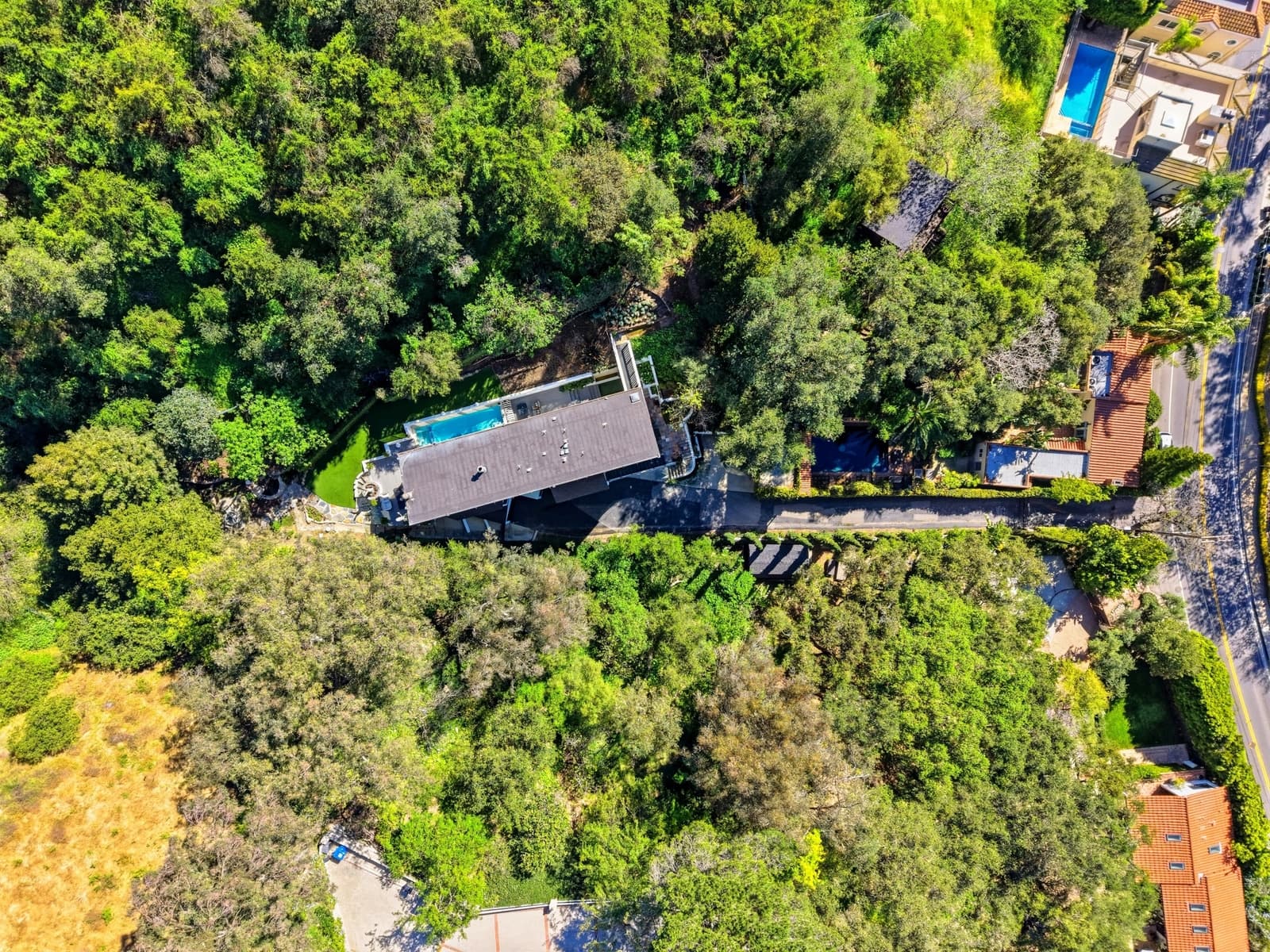 Aerial context view of a Beverly Hills estate with a pool