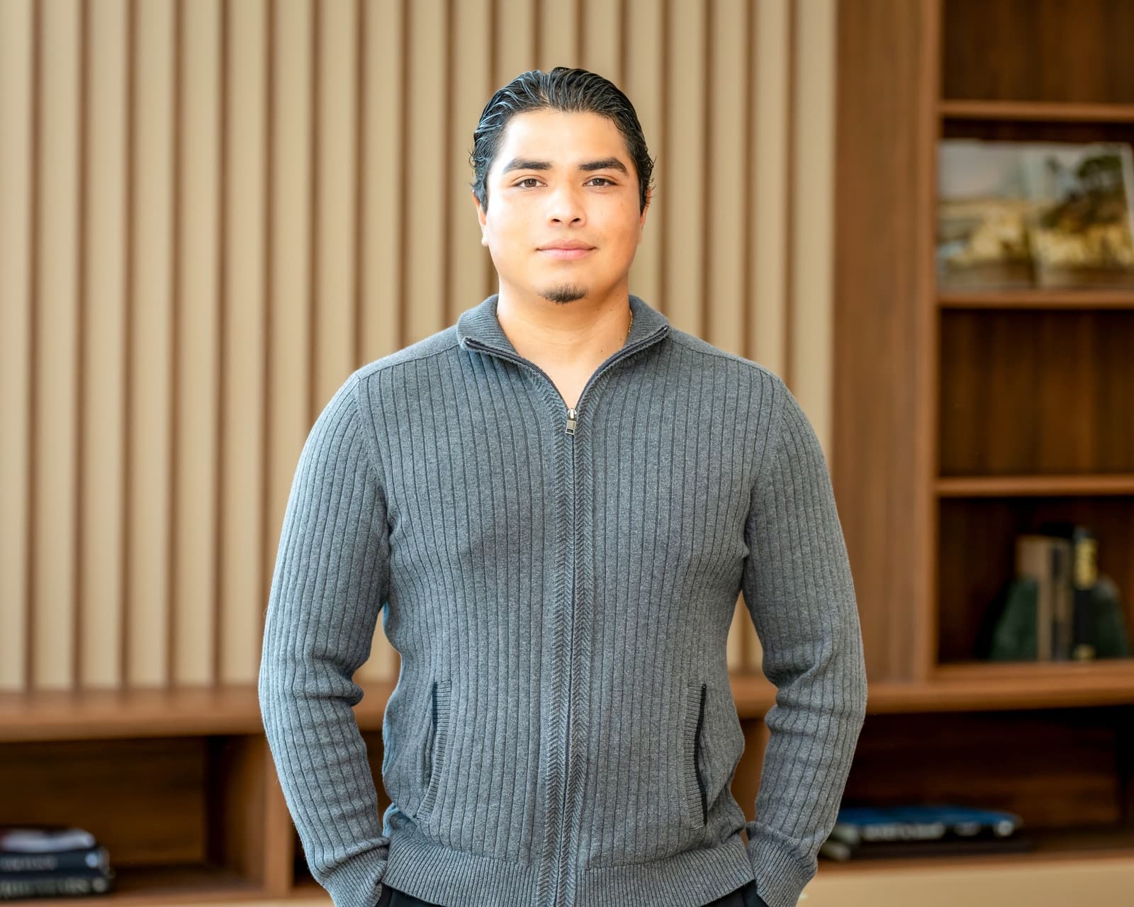 Agent portrait in front of a bookshelf, from a branding session