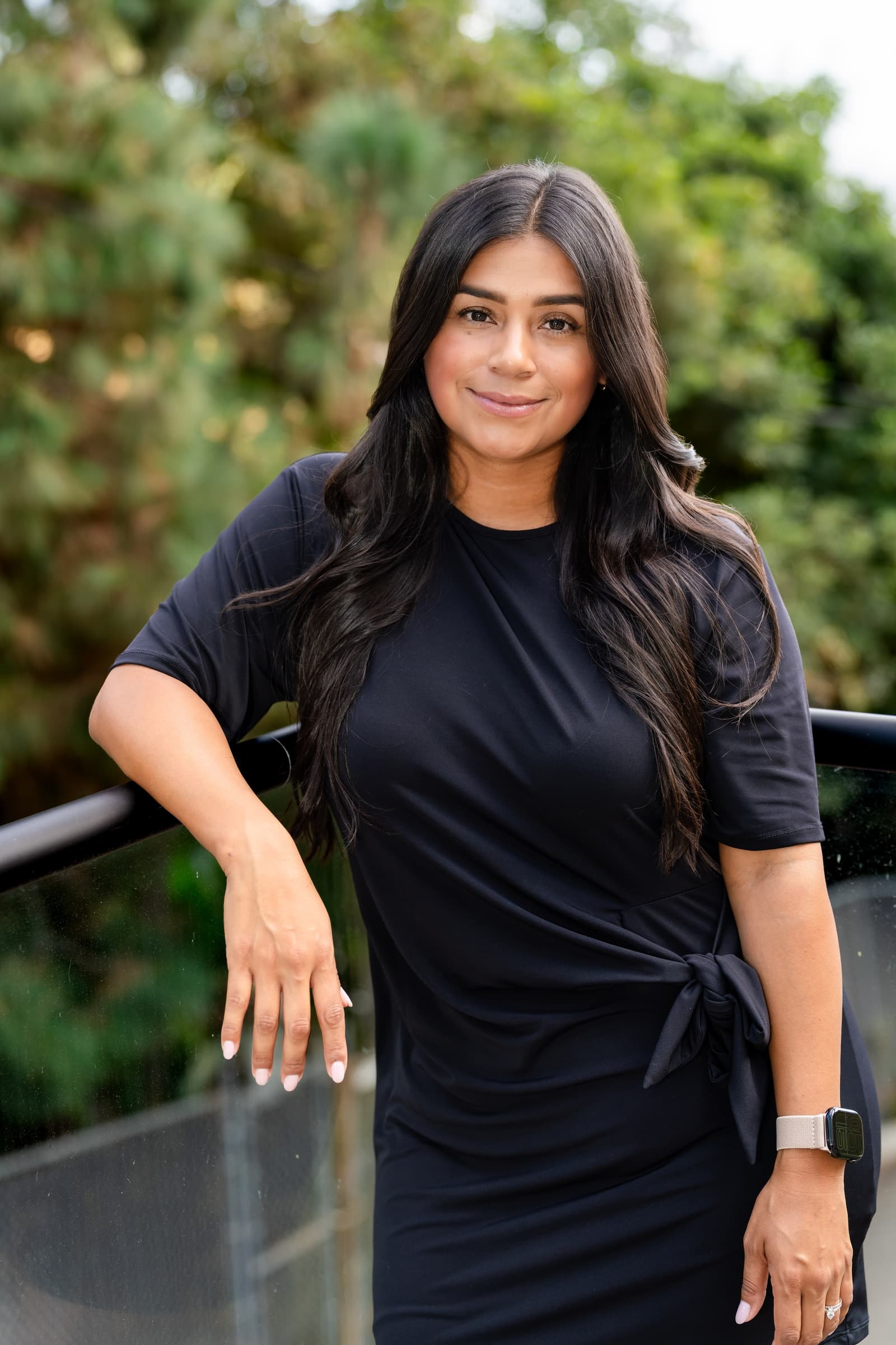 Agent portrait at a railing, from a branding session