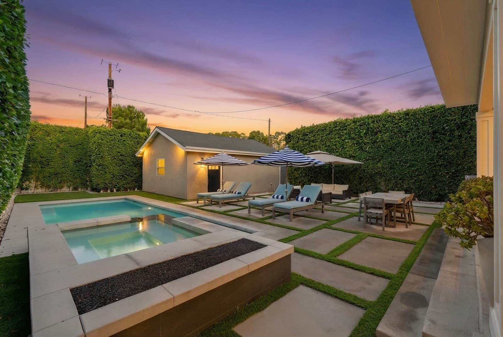 Pool at sunset behind a tall hedge, Burbank