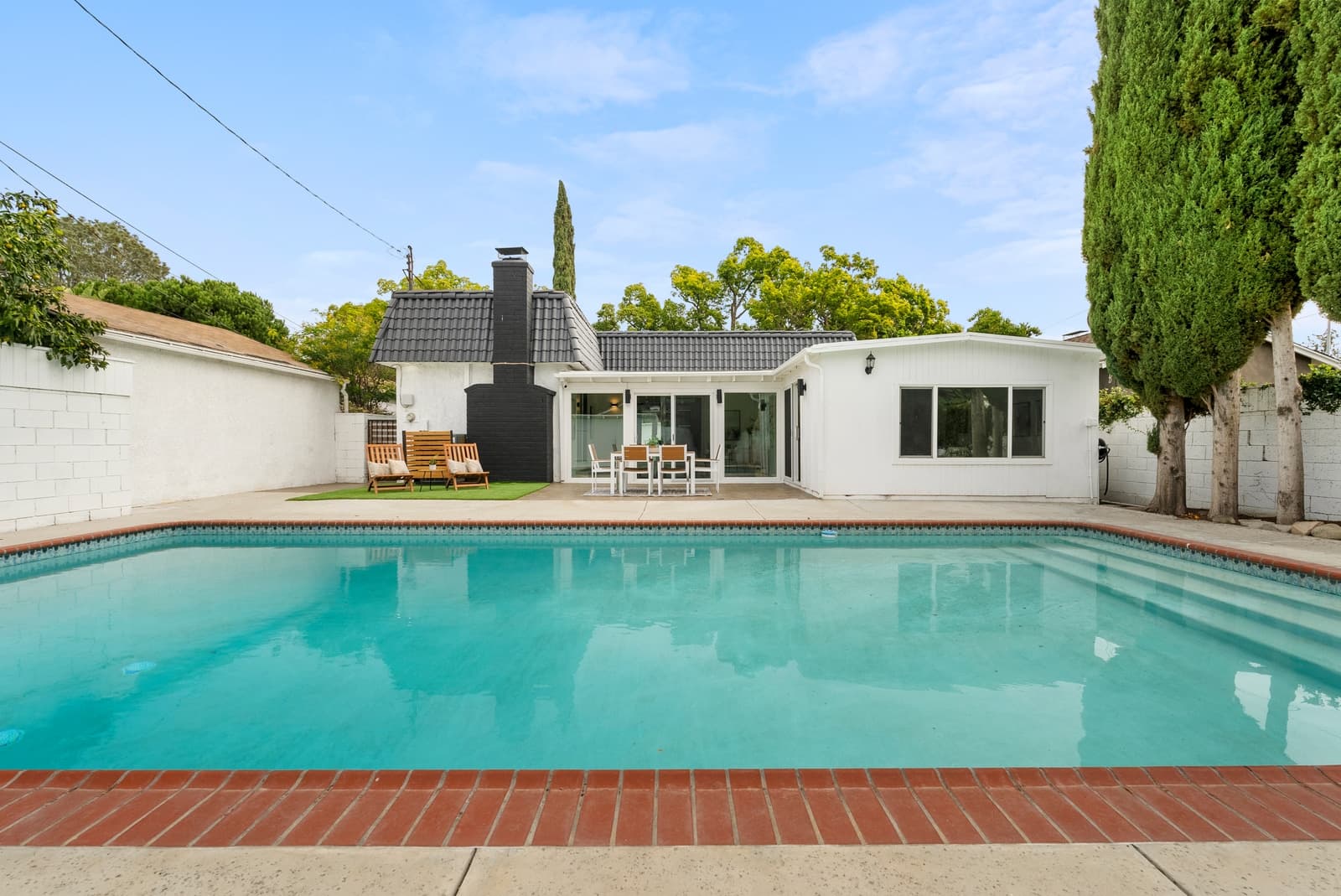 Pool behind a white Spanish home, Burbank