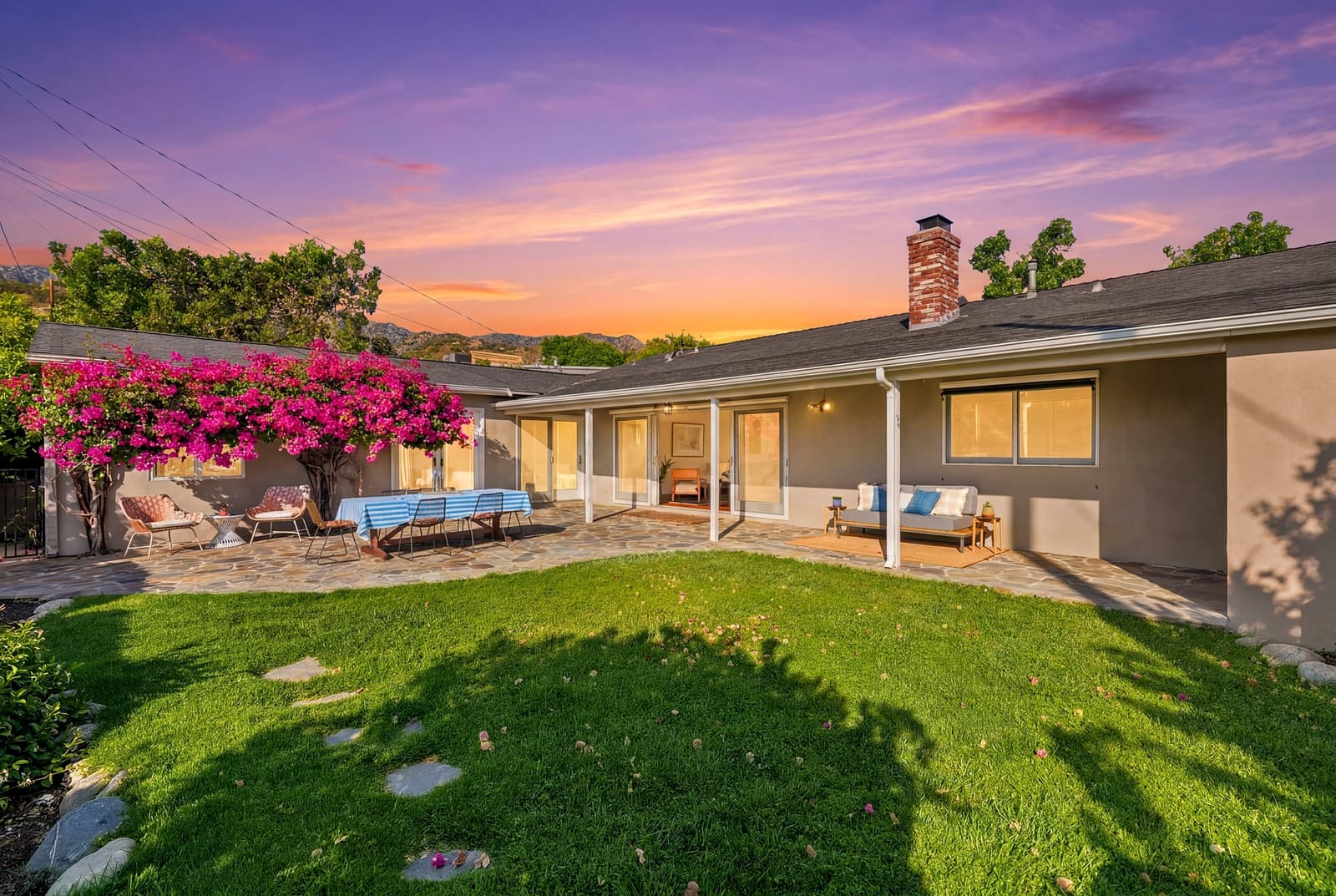 Burbank ranch at twilight, rear lawn and bougainvillea