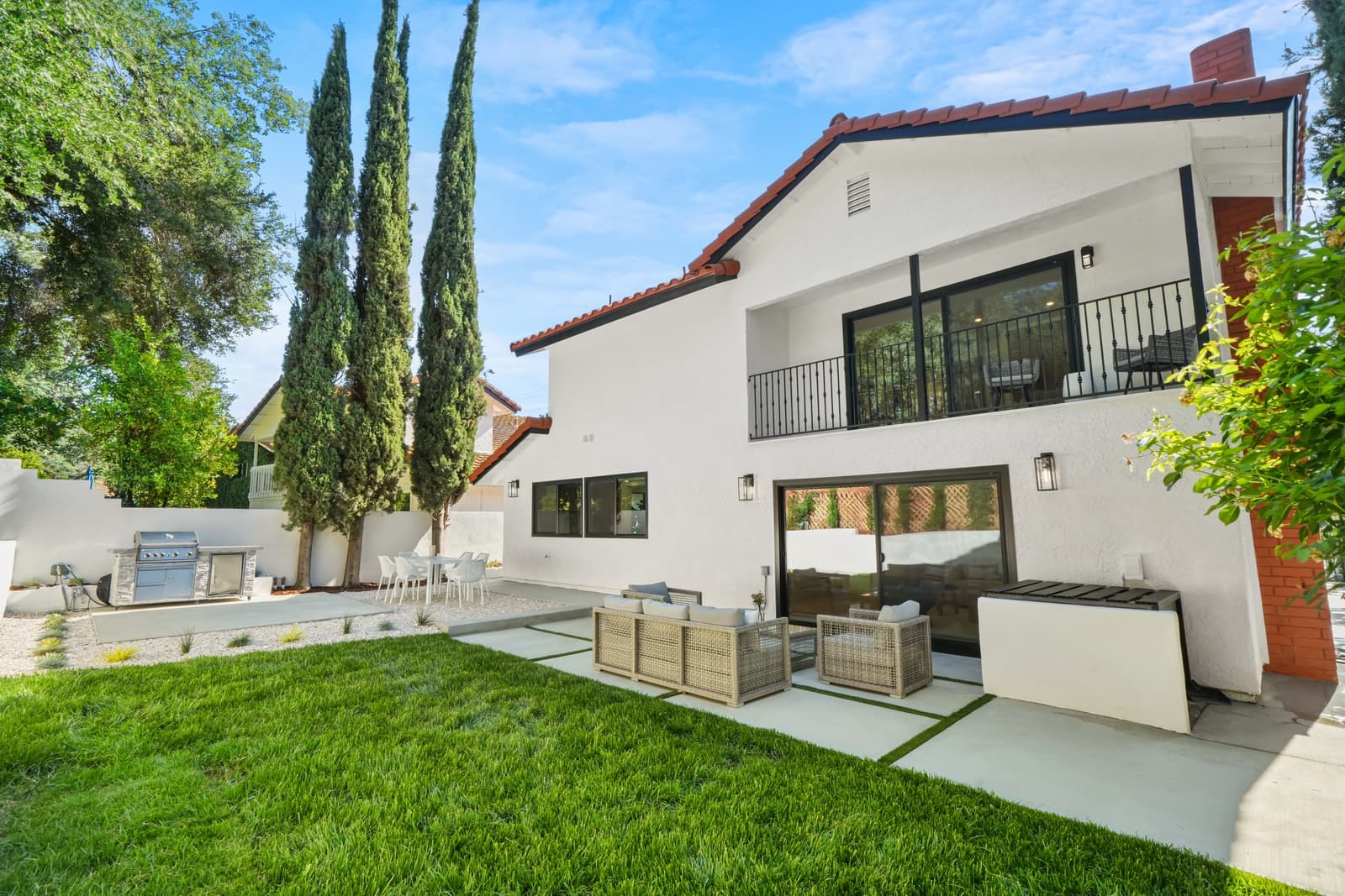 Rear patio at dusk, glass doors open, Calabasas
