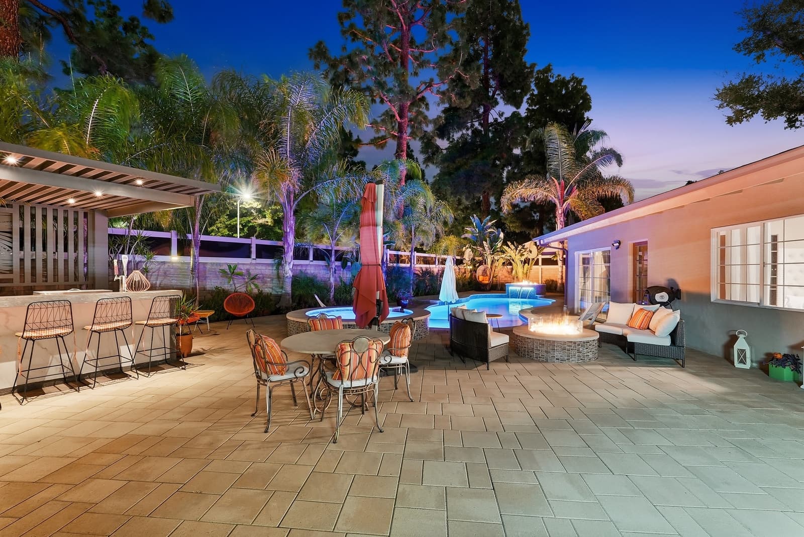 Resort-style pool at twilight with umbrellas, Chatsworth