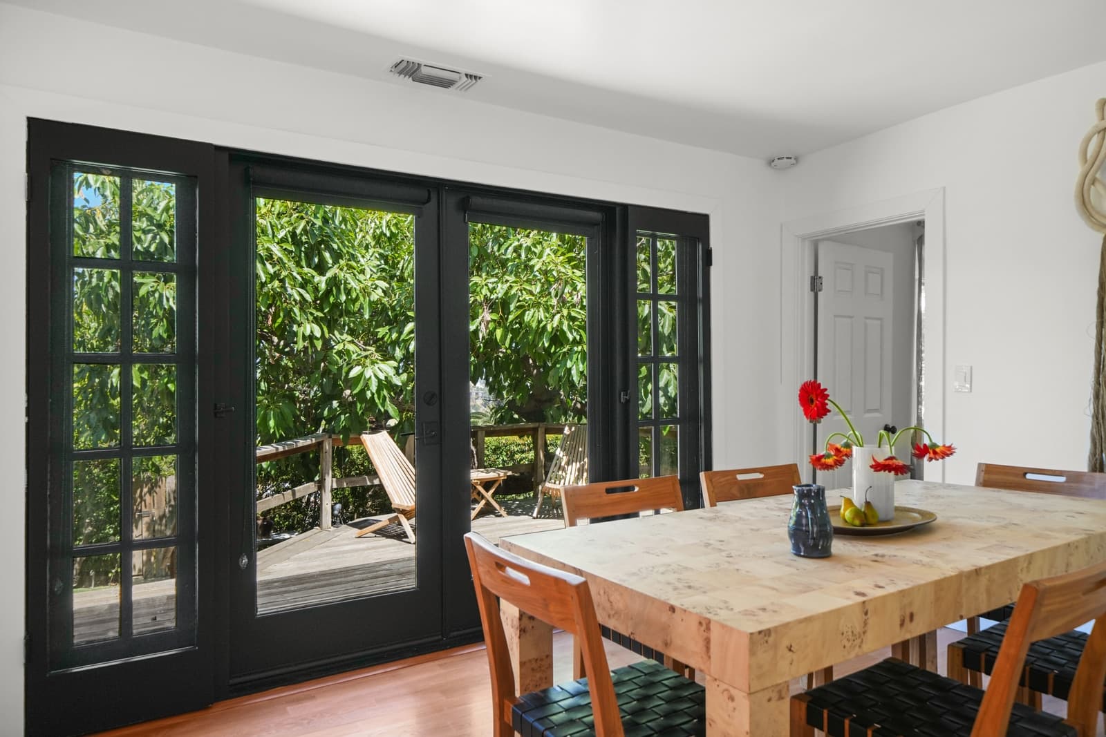 Dining table at open French doors