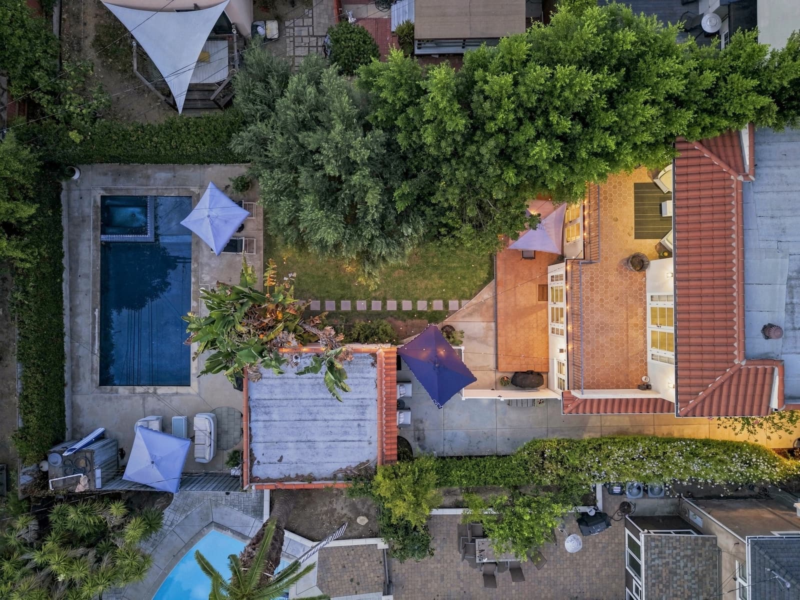 Drone straight down at twilight, pool and patio