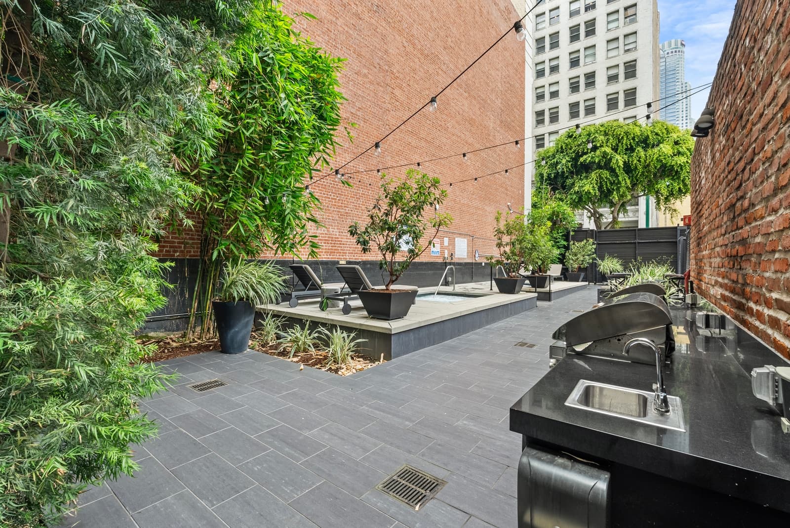 Rooftop amenity deck with skyline view, photographed by VVT in Downtown LA