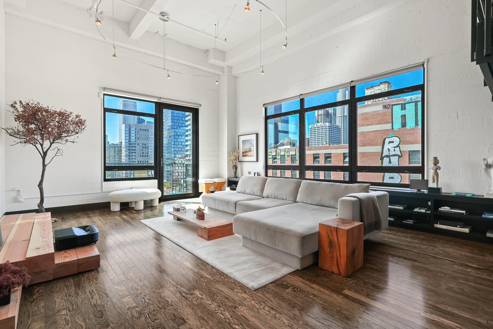Loft living room with tall windows over Broadway