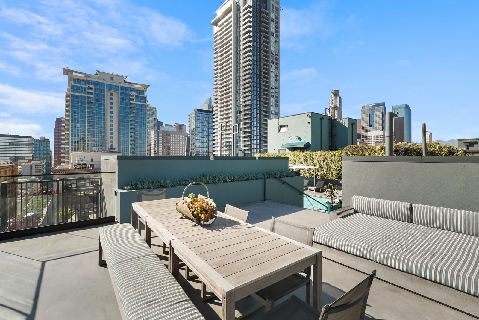 Rooftop terrace lounge with the downtown skyline behind