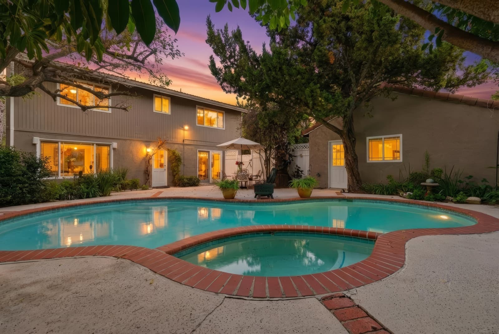 Kidney pool at twilight, house lit, Encino