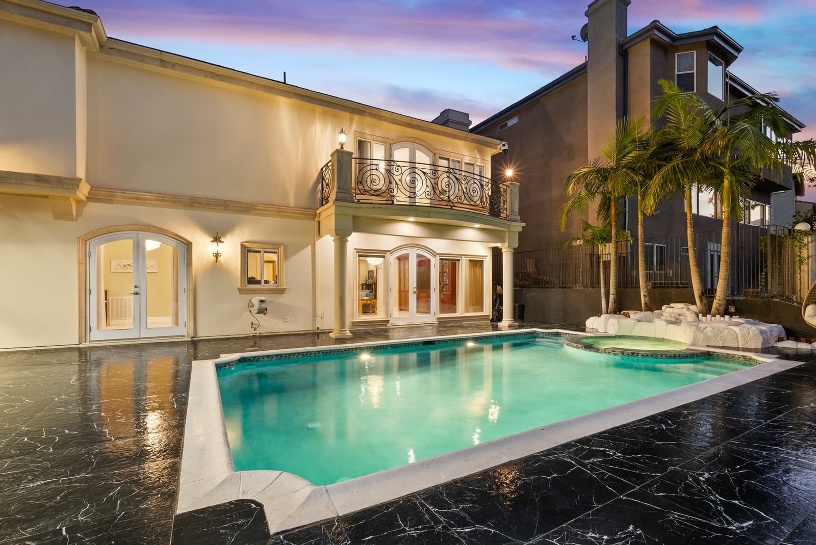 Rear of a Glendale estate at twilight, pool lit
