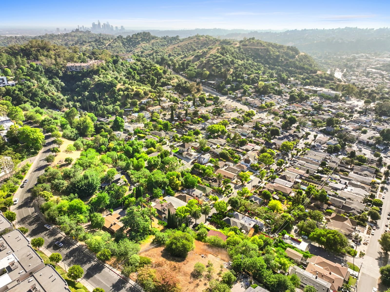 Drone over the Highland Park hills at golden hour