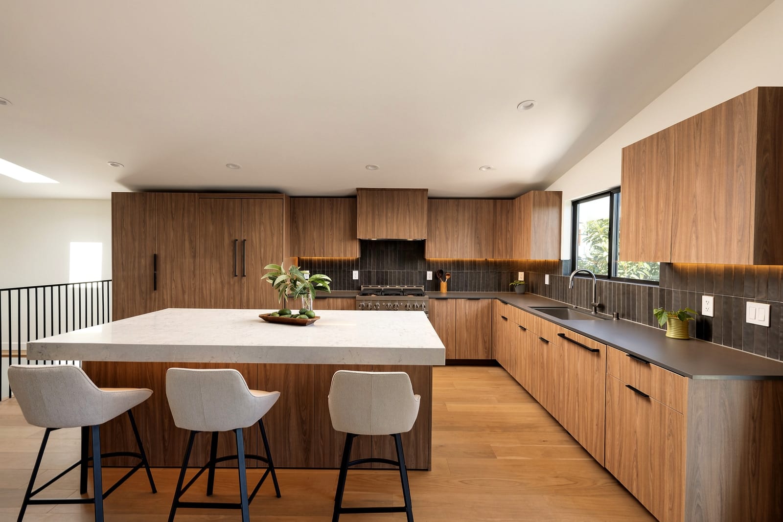 Walnut kitchen with a pale stone island