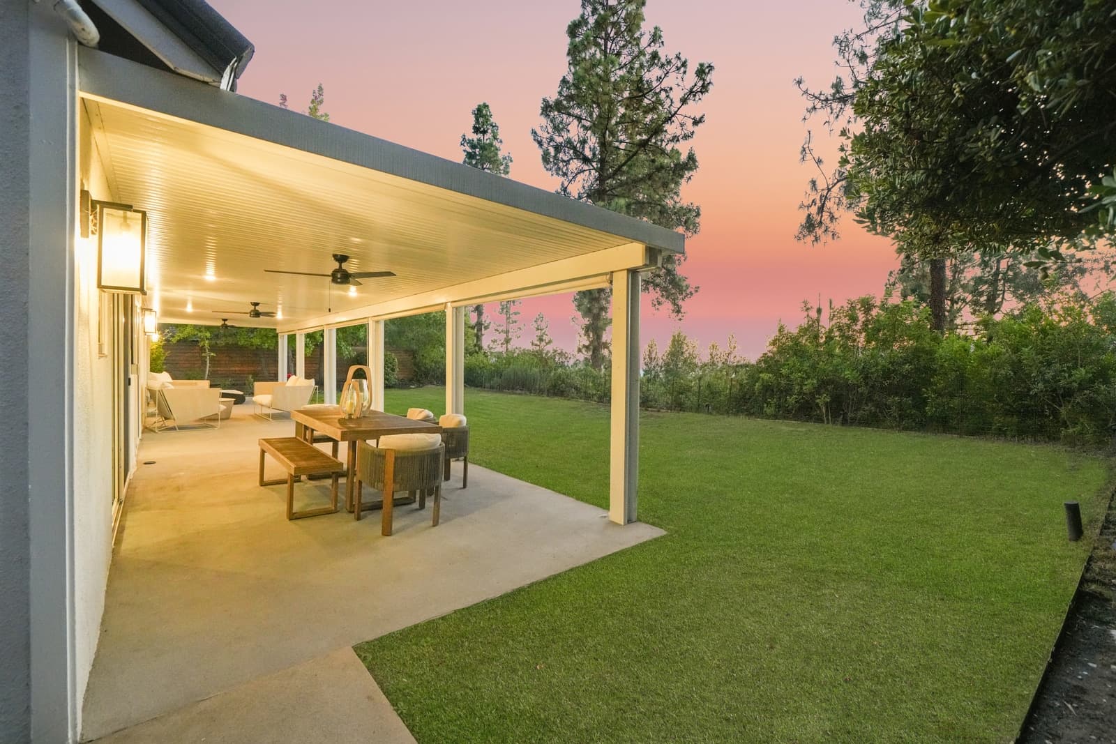 Covered patio at sunset, dining lit, La Cañada