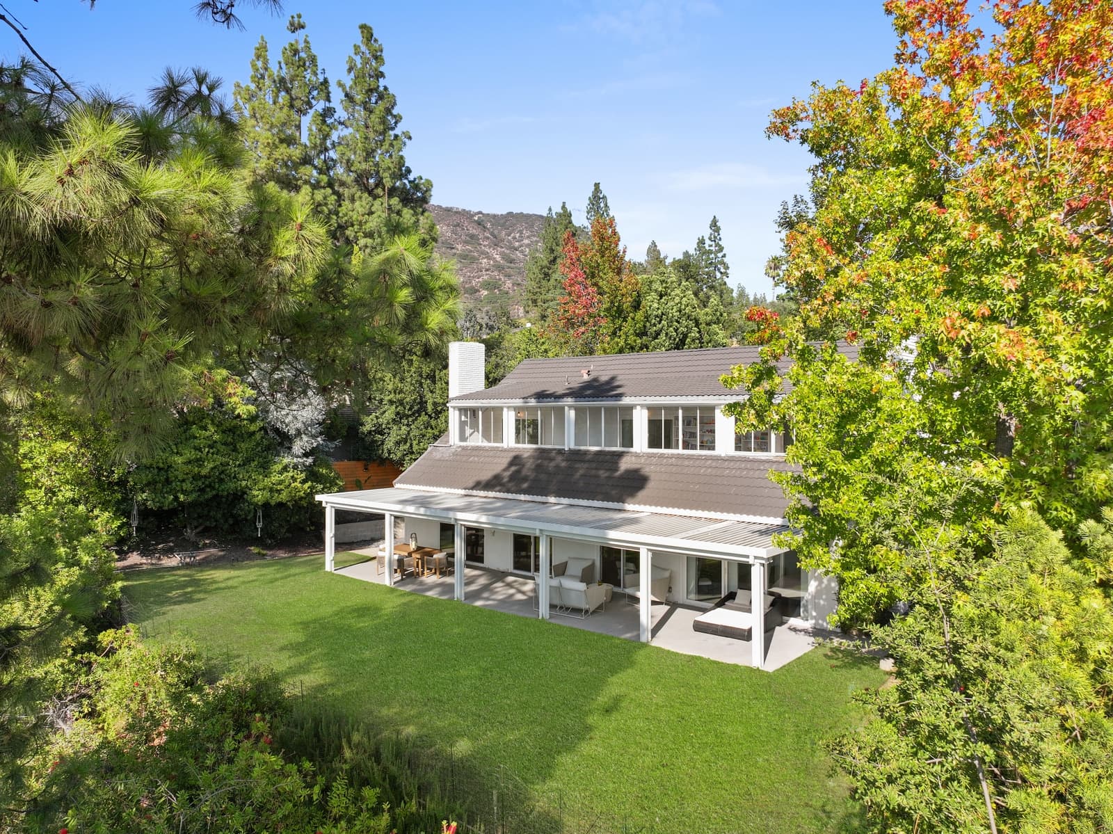 Drone over the rear lawn and covered patio, La Cañada