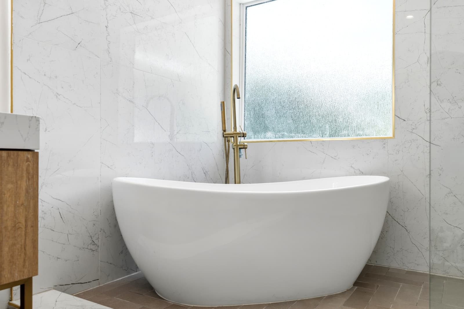 Marble slab bathroom with a freestanding tub, standard listing edit