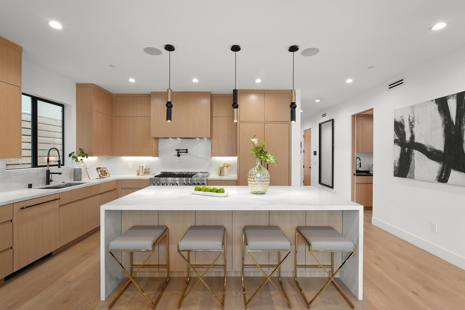 Oak kitchen with an island and pendant lights