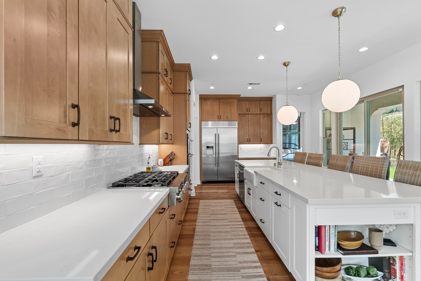Oak kitchen with a long white island