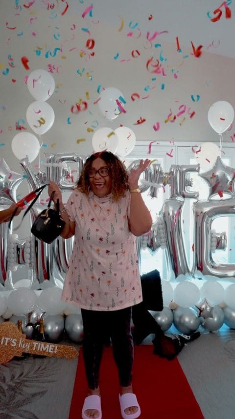 A buyer celebrating among balloons on closing day, from a Sadie Oz key-day reel
