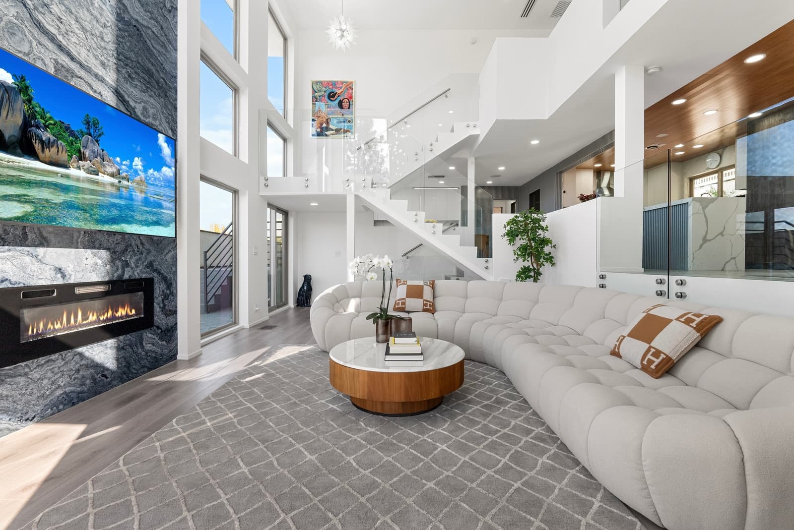 Modern living room under a wood ceiling, glass on three sides