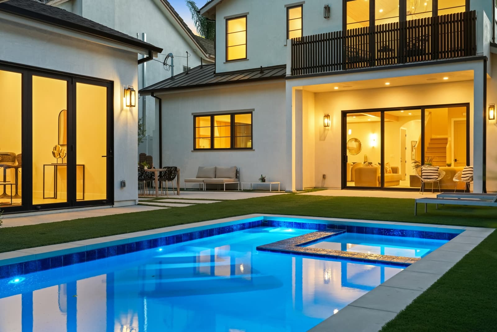 Pool and rear of a modern at twilight, Sherman Oaks