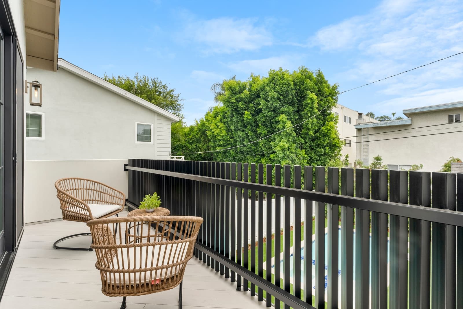 Two-story modern at twilight, arched windows lit, Sherman Oaks