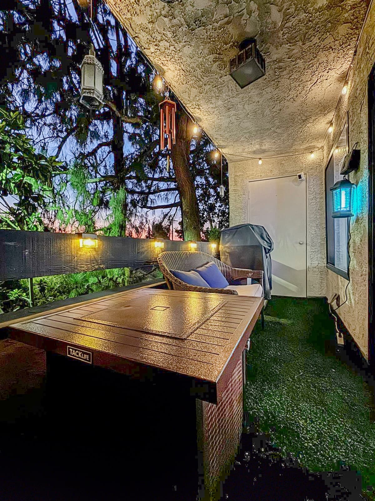 Deck under string lights at dusk, Studio City