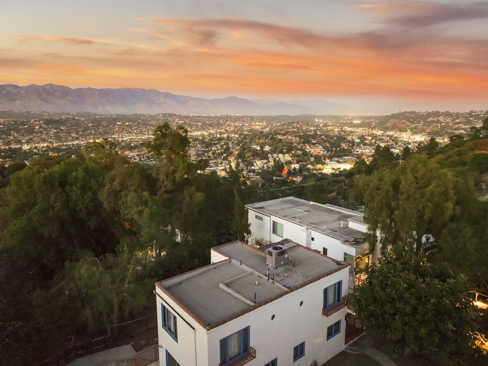 Sunset over the hills toward downtown from a hillside home