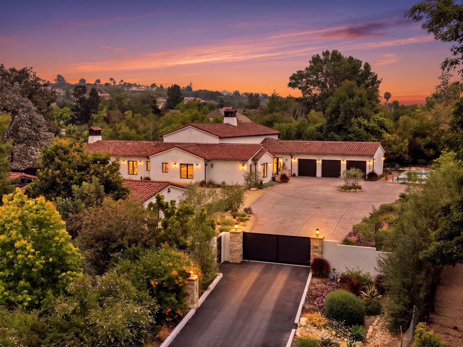 Aerial view of a Spanish-style estate at twilight