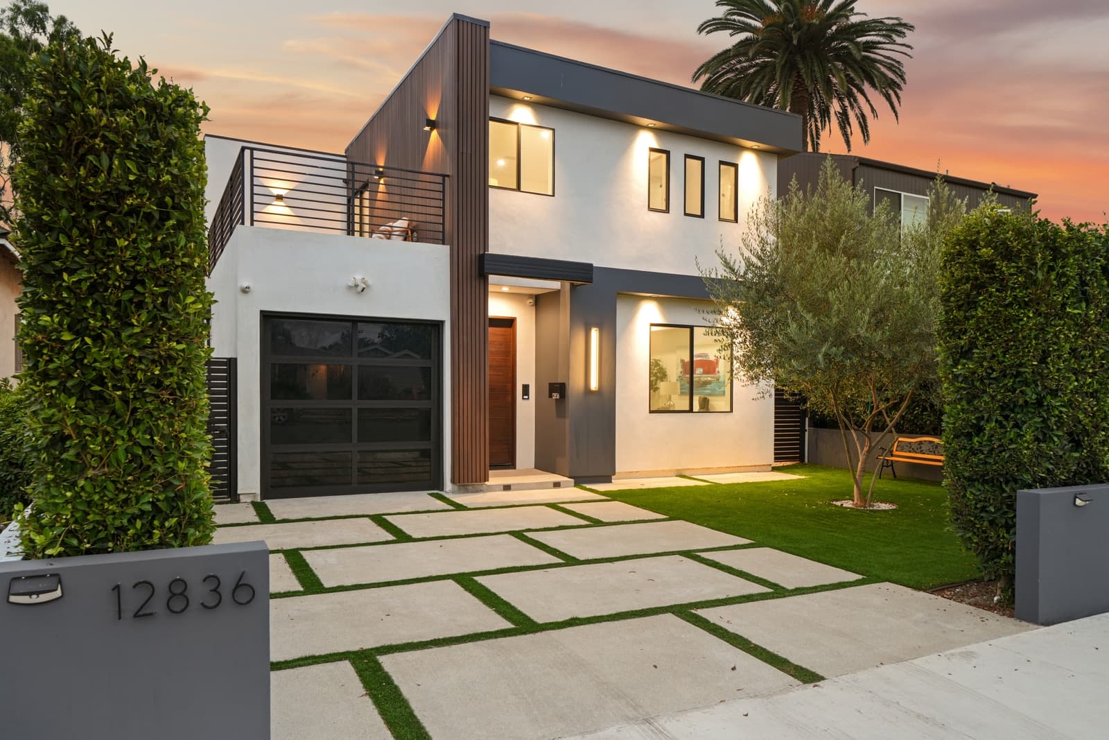 Modern two-story home at twilight