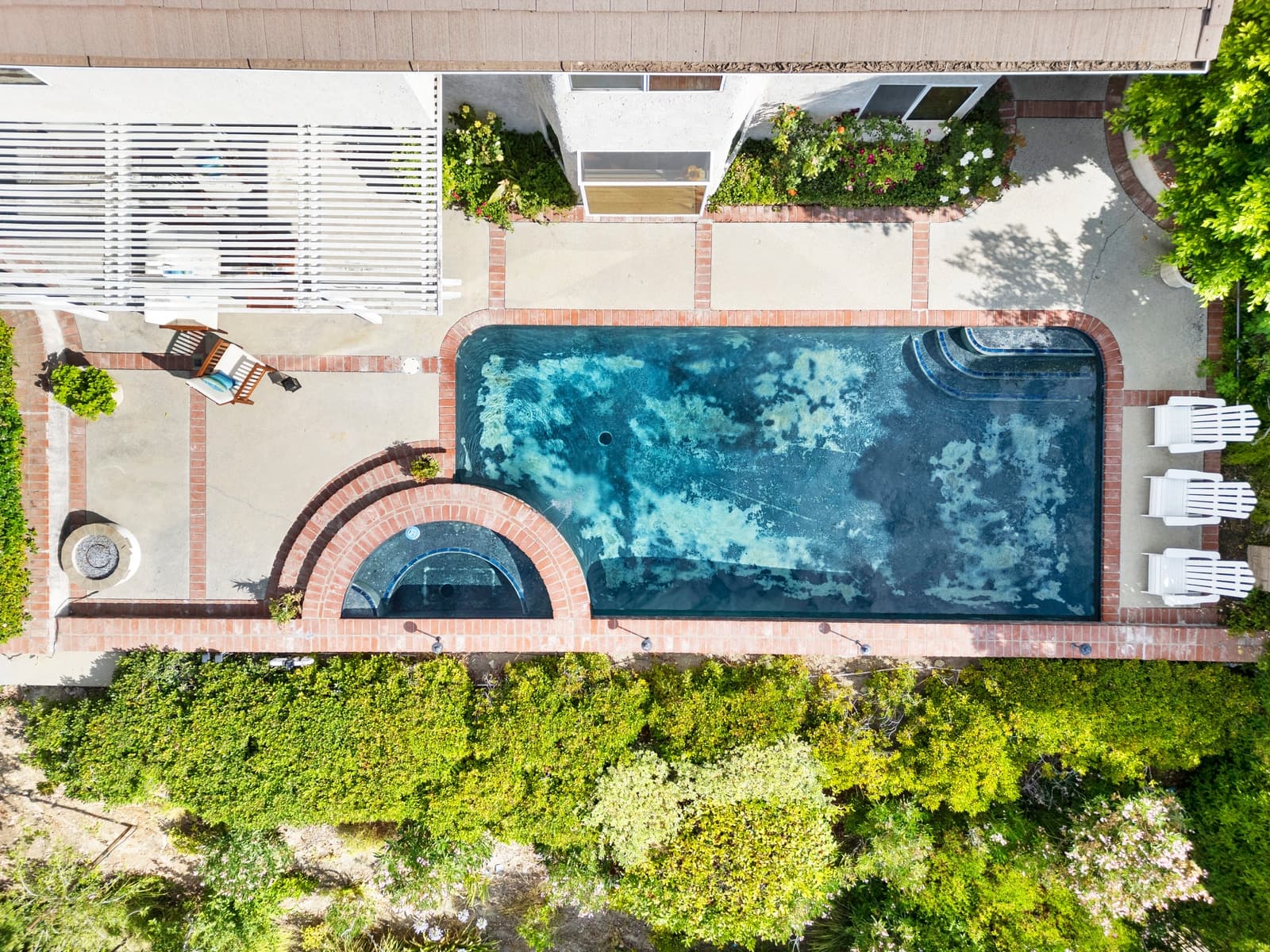 Drone view of a West Hills home and its pool
