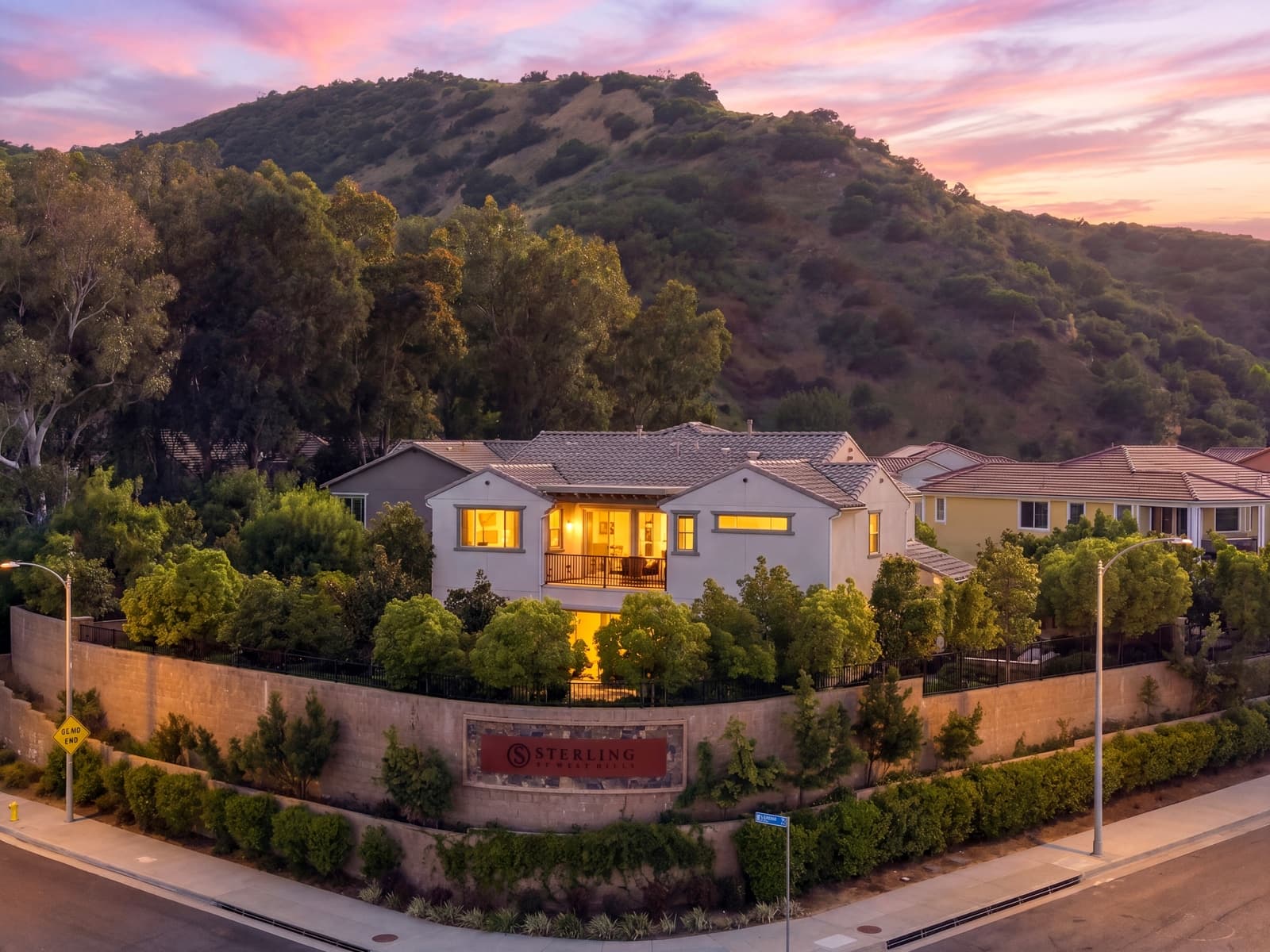 Drone twilight over a West Hills home against the hillside