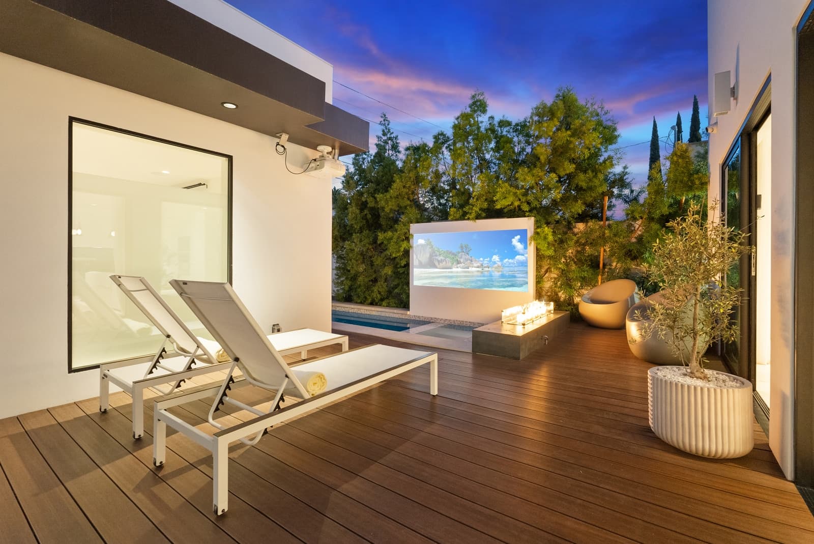 Hammock and fire pit at twilight beside the pool