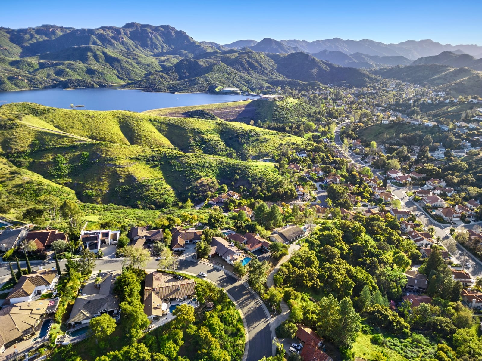 Drone over Westlake Lake toward the mountains