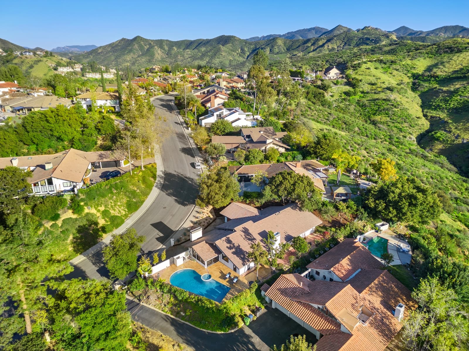 Drone view over Westlake Village toward the lake and hills