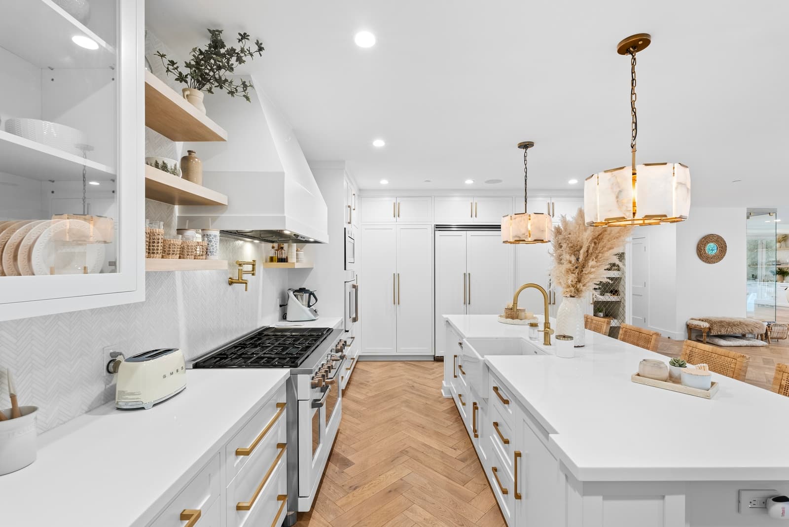 White kitchen with a herringbone floor