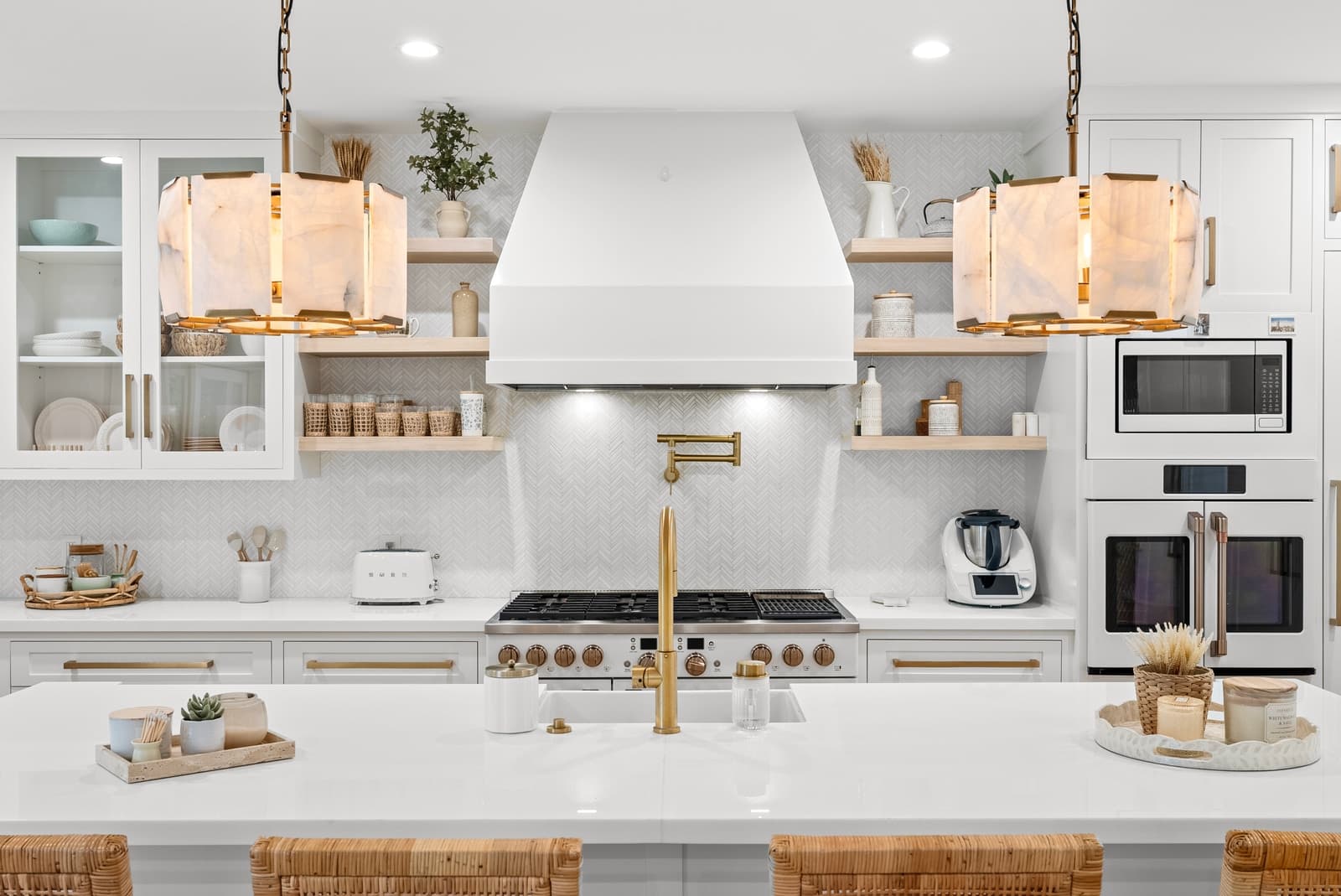 White kitchen with a range wall and open shelving