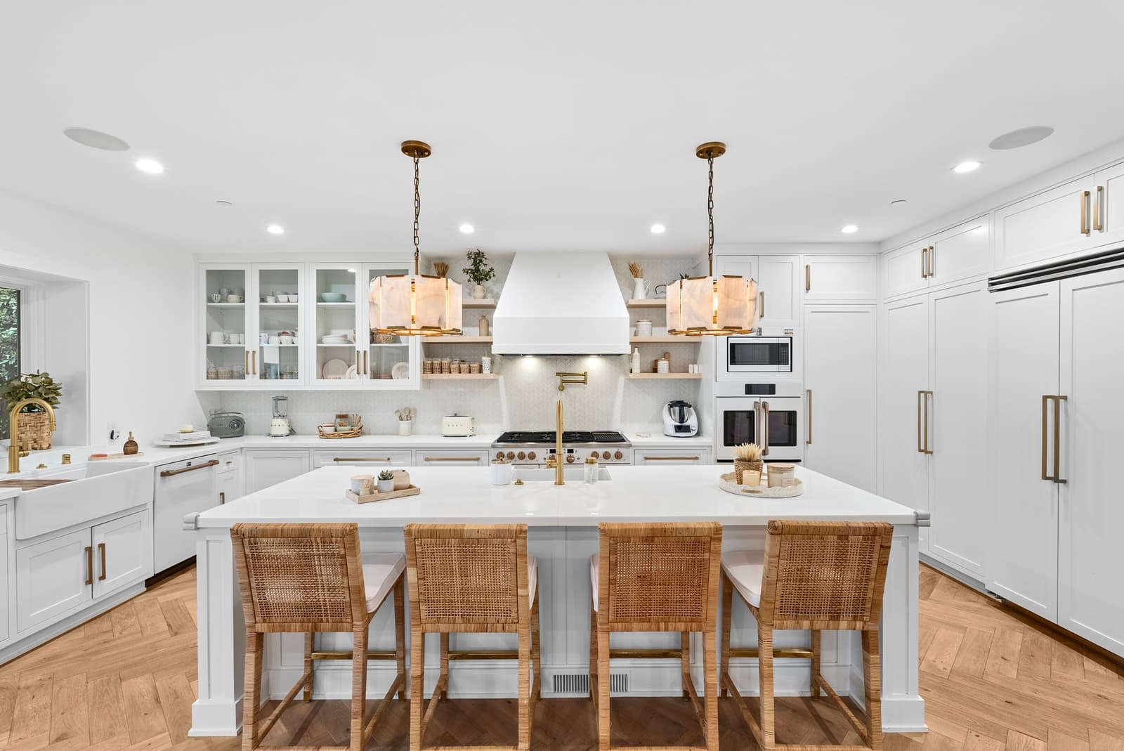 White kitchen with rattan counter stools
