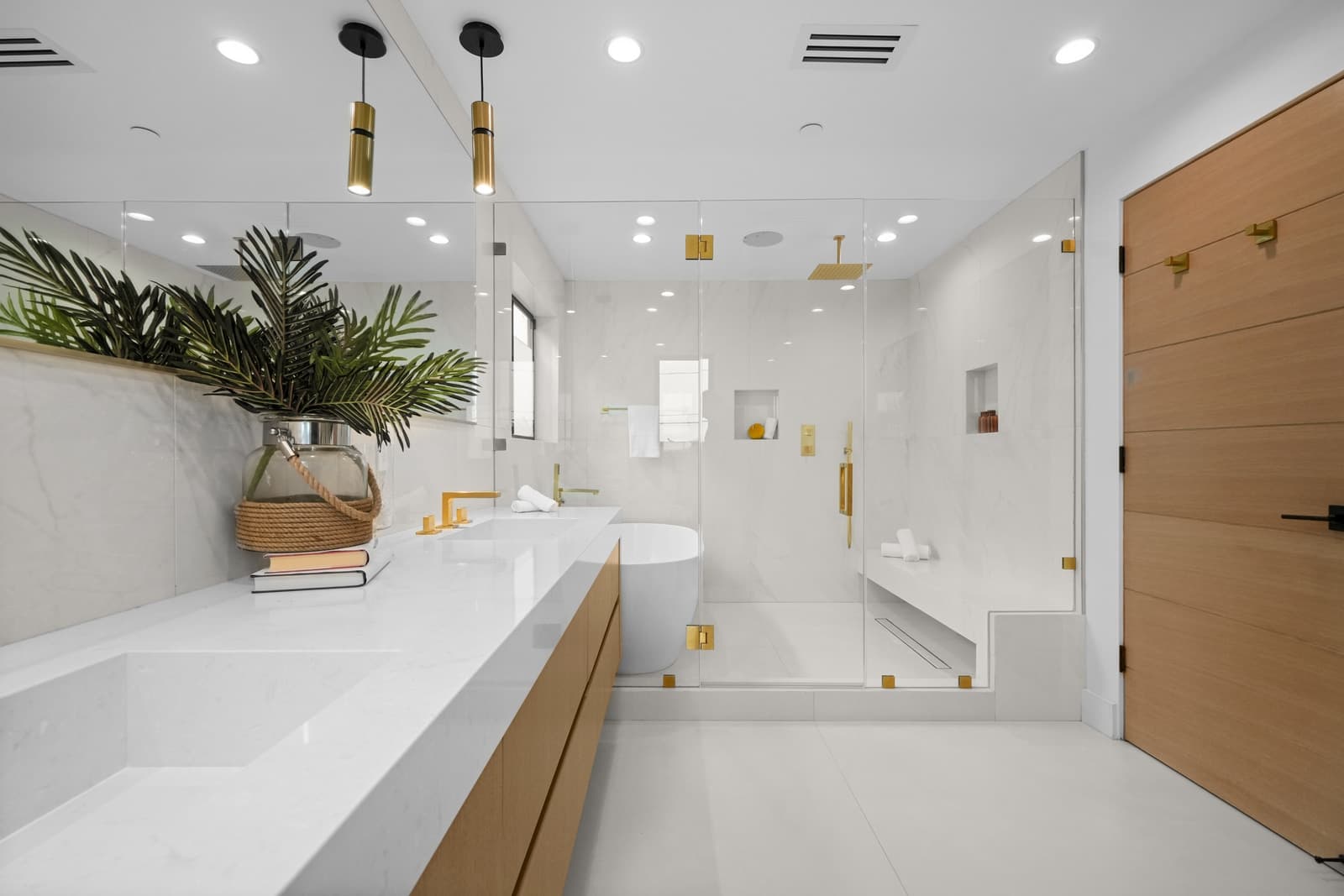 Marble bathroom with brass pendant lights