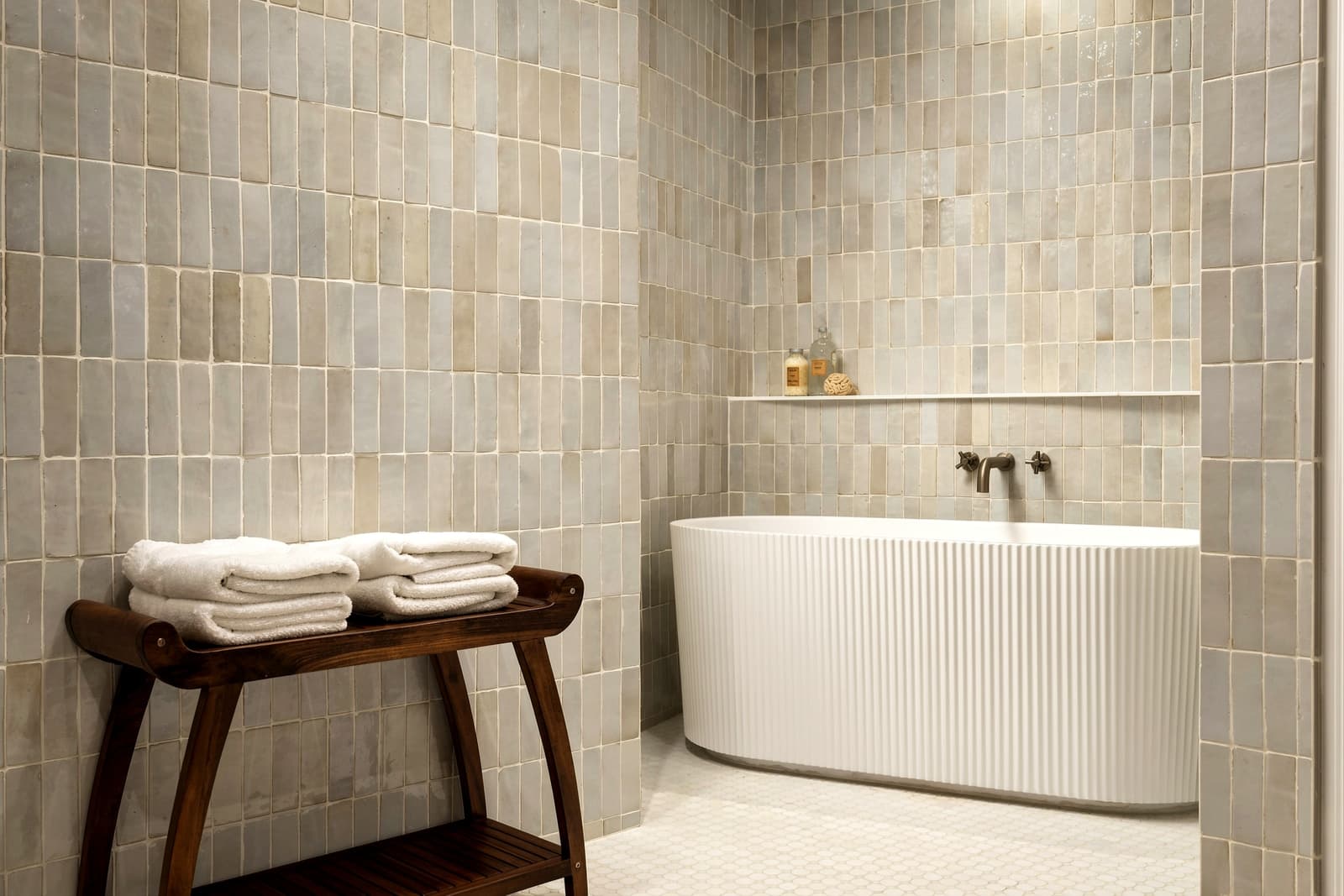 Zellige-tiled bath with a freestanding tub