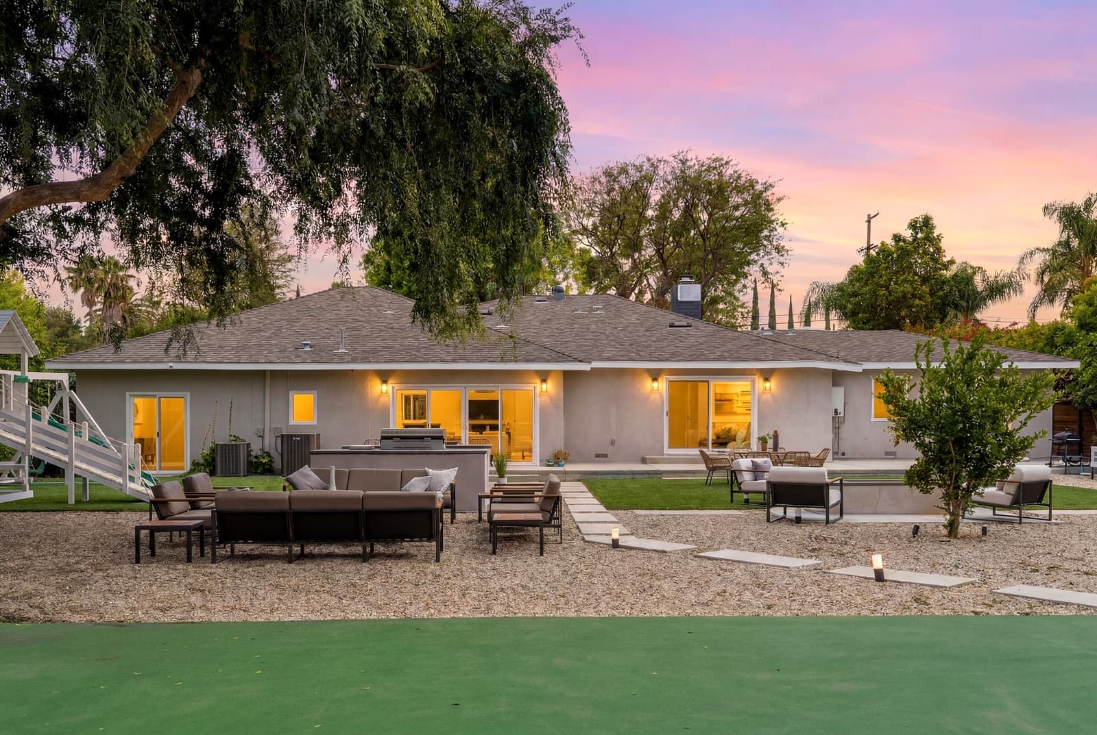 Rear of a modern at twilight across the turf, Woodland Hills